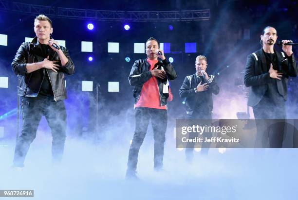 Nick Carter, Howie Dorough, Brian Littrell and Kevin Richardson of band the Backstreet Boys perform onstage at the 2018 CMT Music Awards at...