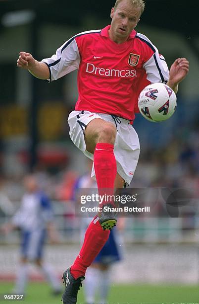 Dennis Bergkamp of Arsenal brings the ball down during the Pre-season friendly match between Rushden and Diamonds and Arsenal played at Nene Park in...