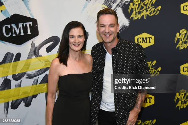 Senior VP of Music Strategy at CMT, Leslie Fram and Craig Campbell attend the 2018 CMT Music Awards at Bridgestone Arena on June 6, 2018 in...
