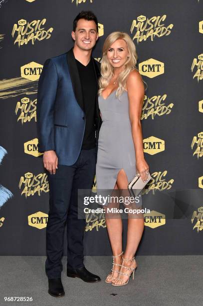 Auto racer Courtney Force and Graham Rahal attend the 2018 CMT Music Awards at Bridgestone Arena on June 6, 2018 in Nashville, Tennessee.