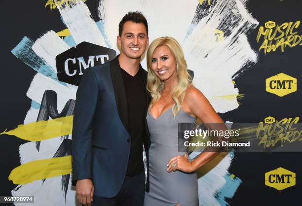 Graham Rahal and Courtney Force attend the 2018 CMT Music Awards at Bridgestone Arena on June 6, 2018 in Nashville, Tennessee.