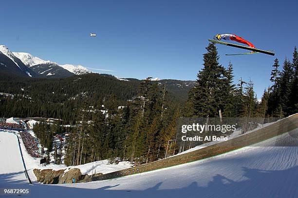 Andreas Kuettel of Switzerland soars off the Long Hill during the qualification round on day 8 of the 2010 Vancouver Winter Olympics at Ski Jumping...