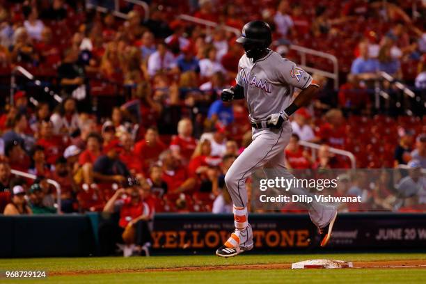 Lewis Brinson of the Miami Marlins rounds third base after hitting a triple St. Louis Cardinals in the seventh inning at Busch Stadium on June 6,...