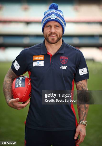 Nathan Jones of the Demons poses in a Big Freeze 4 beanie during an AFL press conference at the Melbourne Cricket Ground on June 7, 2018 in...