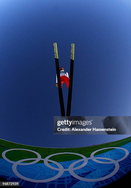 Thomas Morgenstern of Austria soars off the Long Hill during the qualification round on day 8 of the 2010 Vancouver Winter Olympics at Ski Jumping...