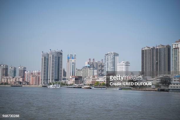 This picture taken on May 30, 2018 shows a general view of residential buildings in the border city of Dandong, in China's northeast Liaoning...