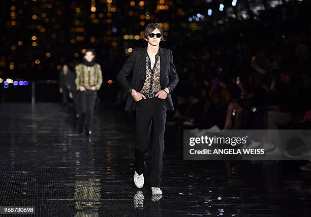 Model presents a creation from the Saint Laurent Men's Spring/Summer 2019 collection during a runway show in Liberty State Park on June 6, 2018 in...