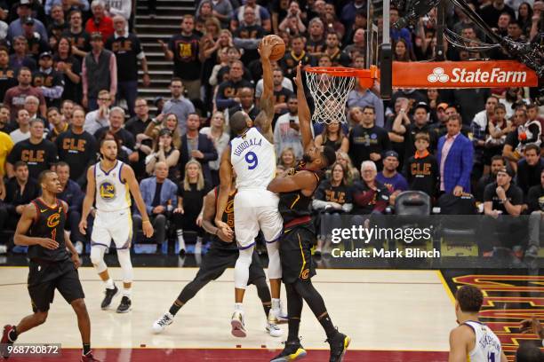 Andre Iguodala of the Golden State Warriors dunks the ball while guarded by Tristan Thompson of the Cleveland Cavaliers in Game Three of the 2018 NBA...