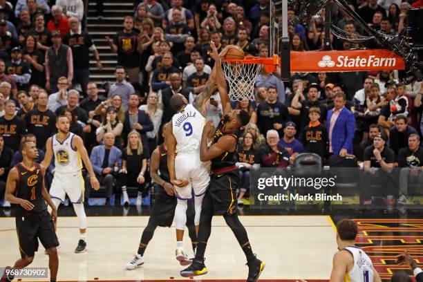 Andre Iguodala of the Golden State Warriors dunks the ball while guarded by Tristan Thompson of the Cleveland Cavaliers in Game Three of the 2018 NBA...