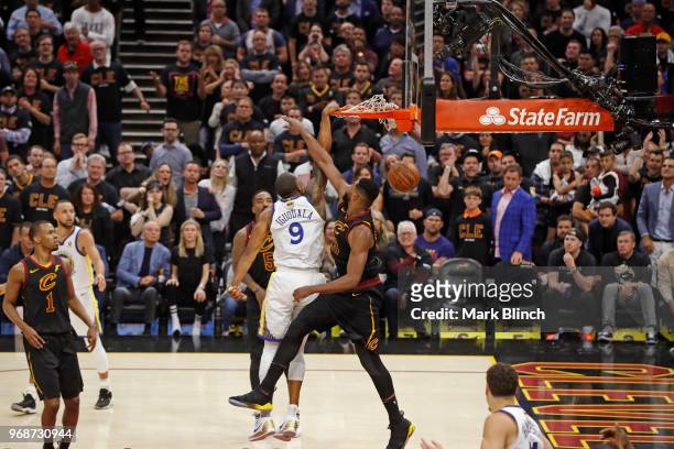 Andre Iguodala of the Golden State Warriors dunks the ball while guarded by Tristan Thompson of the Cleveland Cavaliers in Game Three of the 2018 NBA...