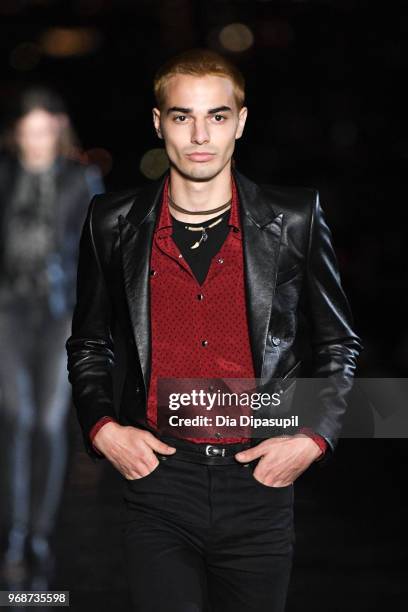 Model walks the runway at the Saint Laurent Resort 2019 Runway Show on June 6, 2018 in New York City.