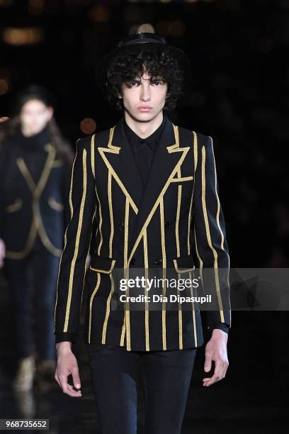 Model walks the runway at the Saint Laurent Resort 2019 Runway Show on June 6, 2018 in New York City.