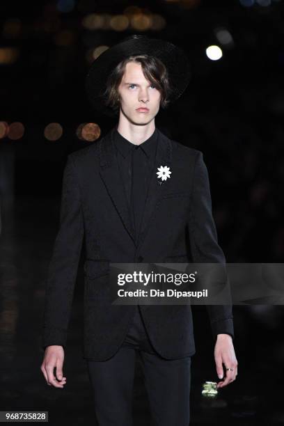 Model walks the runway at the Saint Laurent Resort 2019 Runway Show on June 6, 2018 in New York City.