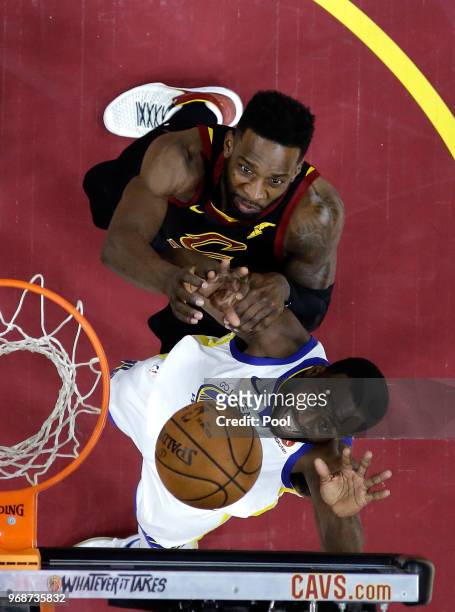 Draymond Green of the Golden State Warriors and Jeff Green of the Cleveland Cavaliers battle for a rebound in the second half during Game Three of...