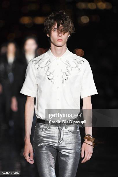 Model walks the runway at the Saint Laurent Resort 2019 Runway Show on June 6, 2018 in New York City.