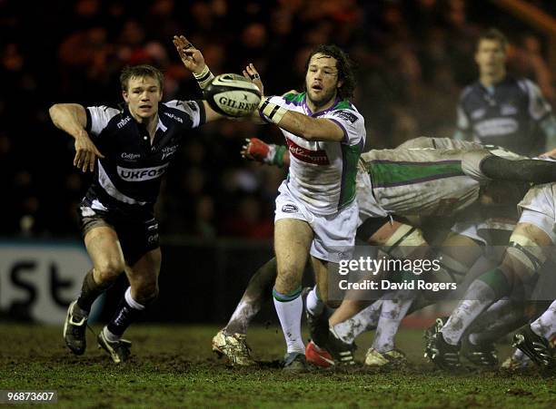Scott Mathie of Leeds passes the ball watched by Dwayne Peel during the Guinness Premiership match between Sale Sharks and Leeds Carnegie at Edgeley...