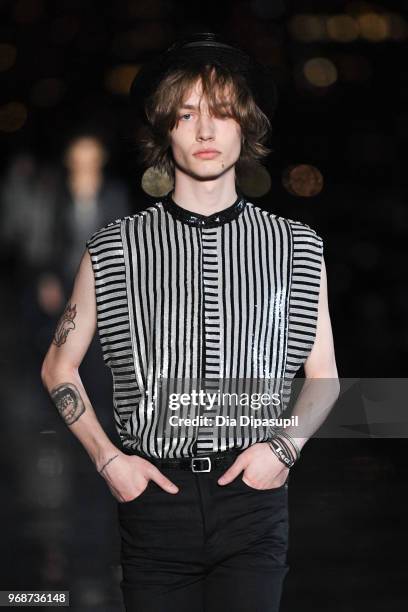 Model walks the runway at the Saint Laurent Resort 2019 Runway Show on June 6, 2018 in New York City.