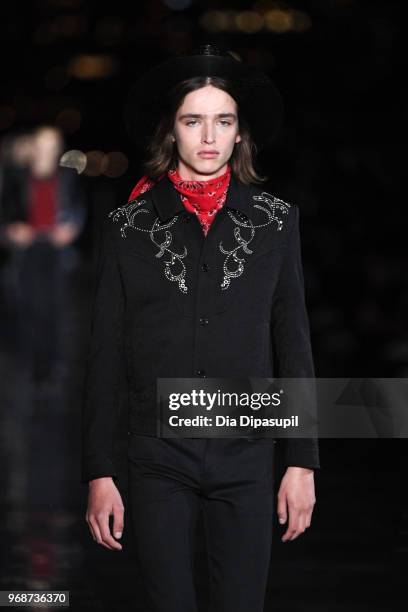 Model walks the runway at the Saint Laurent Resort 2019 Runway Show on June 6, 2018 in New York City.