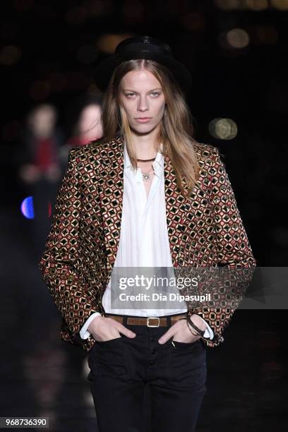 Model walks the runway at the Saint Laurent Resort 2019 Runway Show on June 6, 2018 in New York City.