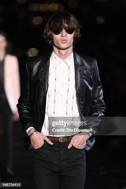 Model walks the runway at the Saint Laurent Resort 2019 Runway Show on June 6, 2018 in New York City.