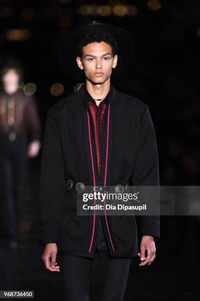 Model walks the runway at the Saint Laurent Resort 2019 Runway Show on June 6, 2018 in New York City.