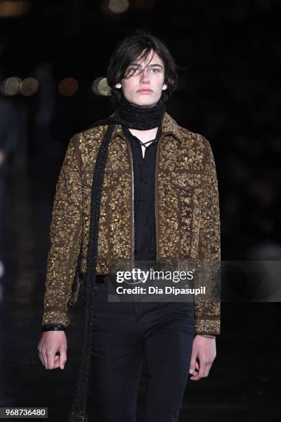 Model walks the runway at the Saint Laurent Resort 2019 Runway Show on June 6, 2018 in New York City.