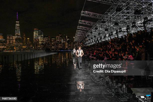 Models walk the runway at the Saint Laurent Resort 2019 Runway Show on June 6, 2018 in New York City.