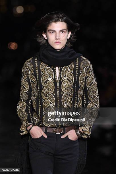 Model walks the runway at the Saint Laurent Resort 2019 Runway Show on June 6, 2018 in New York City.