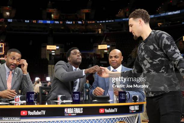 Chris Webber and Klay Thompson of the Golden State Warriors shake hands after Game Three of the 2018 NBA Finals against the Cleveland Cavaliers on...