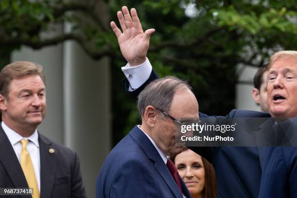 President Donald Trump leaves after he signed S. 2372, the VA Mission Act of 2018 at a ceremony in the Rose Garden of the White House, on Wednesday,...