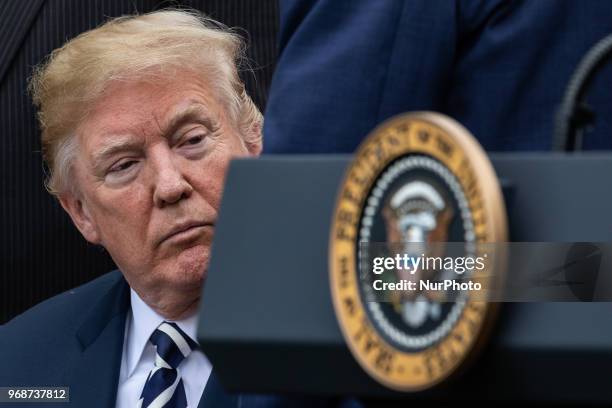 President Donald Trump signs S. 2372, the VA Mission Act of 2018 at a ceremony in the Rose Garden of the White House, on Wednesday, June 6, 2018.