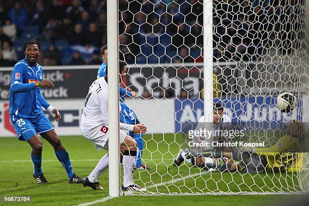 Rául Marcelo Bobadilla of Gladbach scores his team's second goal against goalkeeper Timo Hildebrand of Hoffenheim during the Bundesliga match between...