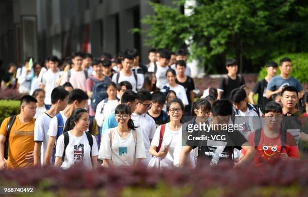 Candidates enter an exam site for the National College Entrance Examination at Liuzhou High School on June 7, 2018 in Liuzhou, Guangxi Province of...