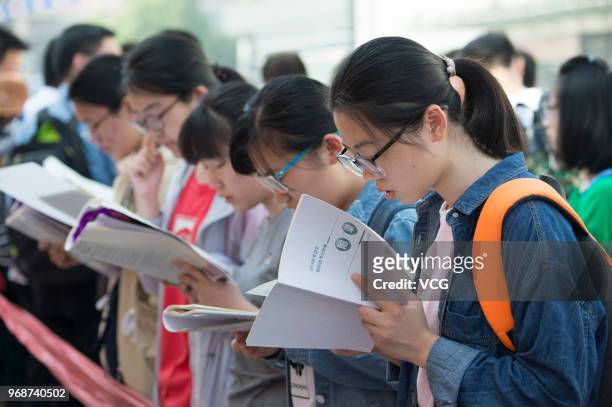 Candidates review before entering an exam site for the National College Entrance Examination on June 7, 2018 in Nantong, Jiangsu Province of China....