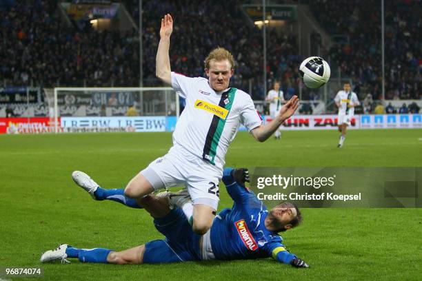 Josip Simunic of Hoffenheim fouls Tobias Levels of Gladbach during the Bundesliga match between 1899 Hoffenheim and Borussia Moenchengladbach at...