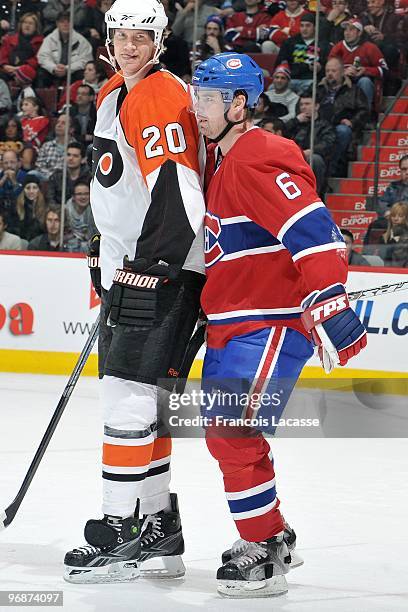 Jaroslav Spacek of the Montreal Canadiens and Chris Pronger of the Philadelphia Flyers wait for a face off during the NHL game on February 13, 2010...