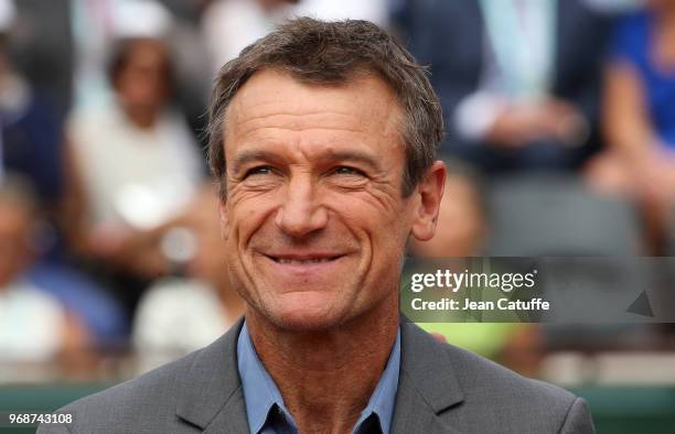 Mats Wilander receives on court a trophy for his 3 titles at the French Open during Day 11 of the 2018 French Open at Roland Garros stadium on June...