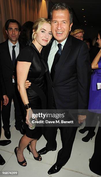 Kate Winslet and Mario Testino attend the Lancome and Harper's Bazaar Pre-BAFTA Party co-hosted by actress Kate Winslet, at St Martin's Lane Hotel on...