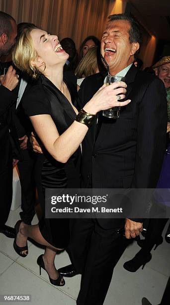 Kate Winslet and Mario Testino attend the Lancome and Harper's Bazaar Pre-BAFTA Party co-hosted by actress Kate Winslet, at St Martin's Lane Hotel on...