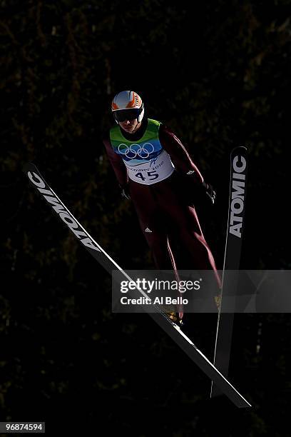 Michael Neumayer of Germany soars off the Long Hill during the qualification round on day 8 of the 2010 Vancouver Winter Olympics at Ski Jumping...