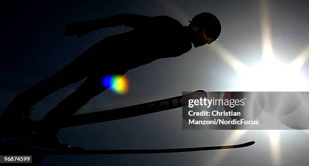 Martin Schmitt of Germany soars off the Long Hill during the qualification round on day 8 of the 2010 Vancouver Winter Olympics at Ski Jumping...