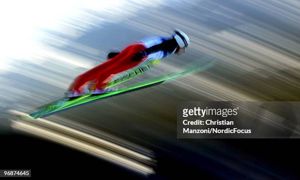 Simon Ammann of Switzerland soars off the Long Hill during the qualification round on day 8 of the 2010 Vancouver Winter Olympics at Ski Jumping...