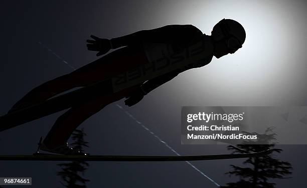 Simon Ammann of Switzerland soars off the Long Hill during the qualification round on day 8 of the 2010 Vancouver Winter Olympics at Ski Jumping...