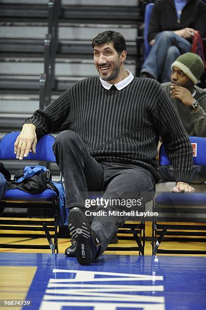 Former NBA player Gheorghe Muresan watches a college basketball game between the American Eagles and the Bucknell Bison on February 11, 2010 at the...