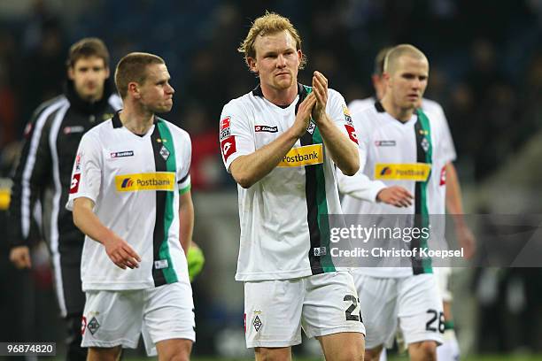 Filip Daems , Tobias Levels and Michael Bradley of Gladbach look dejected after the 2-2 draw of the Bundesliga match between 1899 Hoffenheim and...