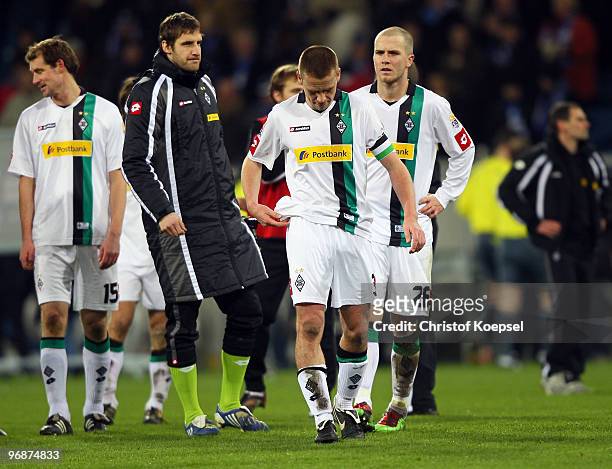 Thomas Kleine of Gladbach, Christofer Heimeroth, Filip Daems and Michael Bradley look dejected after the 2-2 draw of the Bundesliga match between...