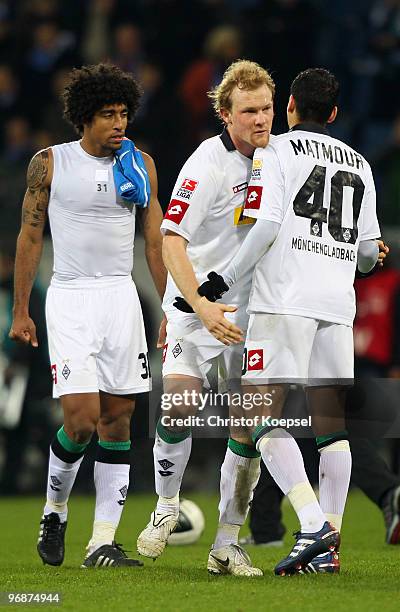 Dante of Gladbach, Tobias Levels and Karim Matmour look dejected after the 2-2 draw of the Bundesliga match between 1899 Hoffenheim and Borussia...