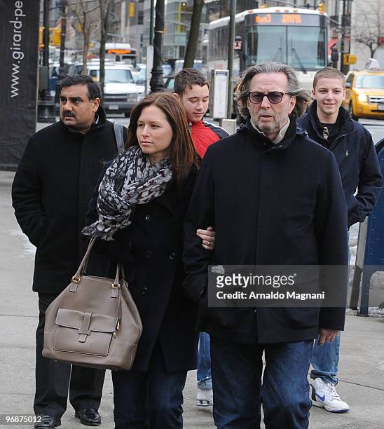Eric Clapton walks with his wife Melia on Madison Avenue on February 19, 2010 in New York City.