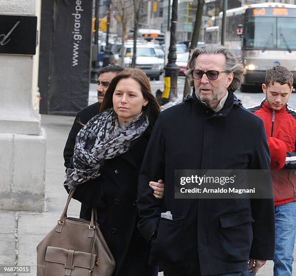 Eric Clapton walks with his wife Melia on Madison Avenue on February 19, 2010 in New York City.