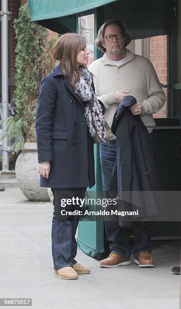 Eric Clapton walks with his wife Melia on Madison Avenue on February 19, 2010 in New York City.